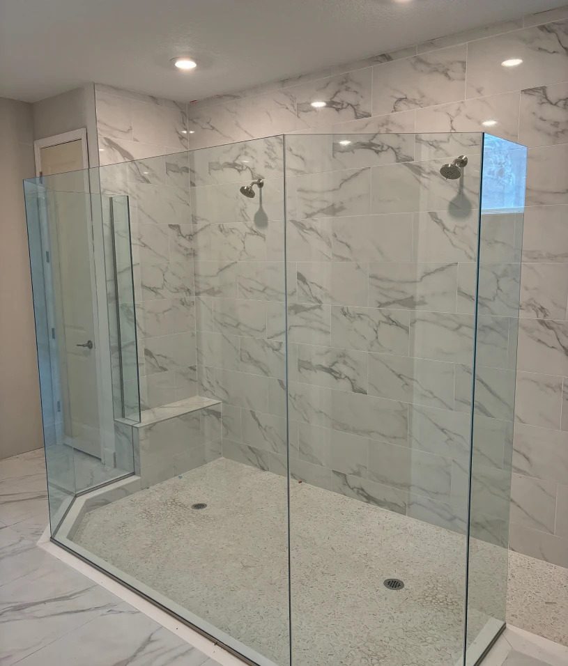 Elegant shower with glass doors and tiles